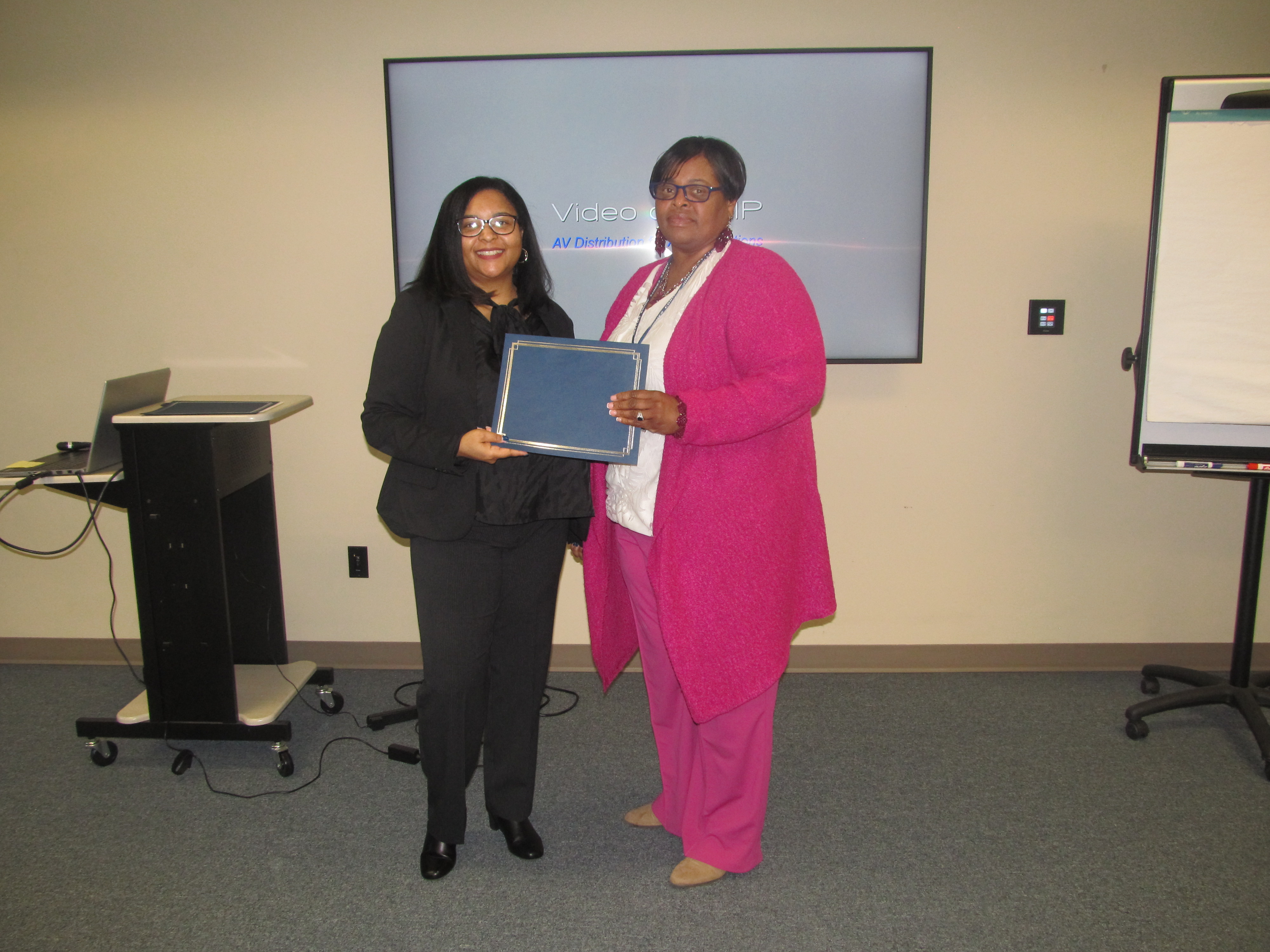 Attendee receiving certificate of completion 